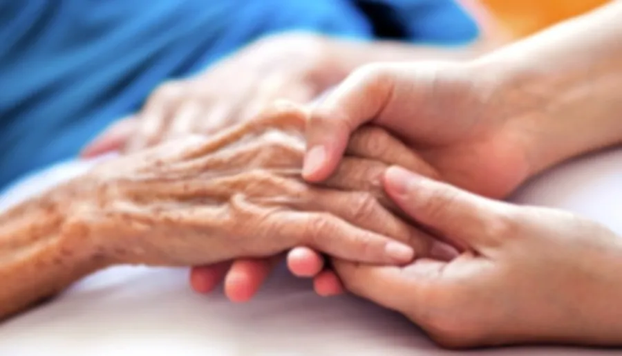 Nurse-led community care supporting someone at home